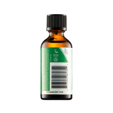 Bottle of oil with a green label on a white background